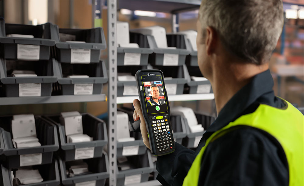 warehouse worker using Zebra device
