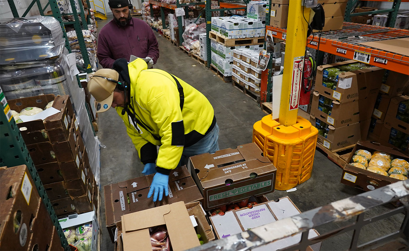 VV warehouse workers building pallet